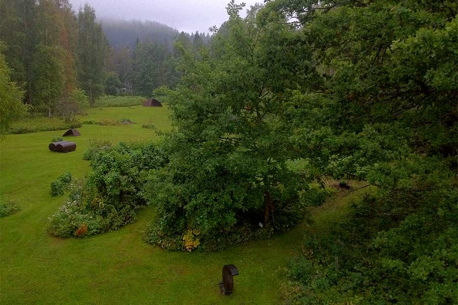Cor-ten steel sculptures exhibited on the clearing (seen to the lake in the west).