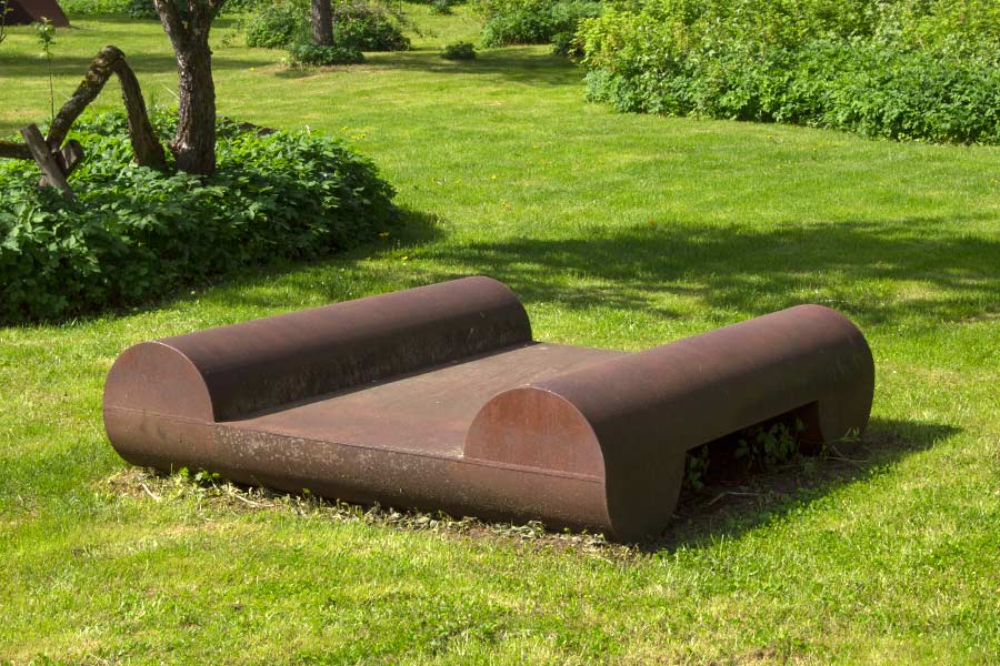 Cor-ten steel sculptures exhibited on the clearing (seen to the lake in the west).